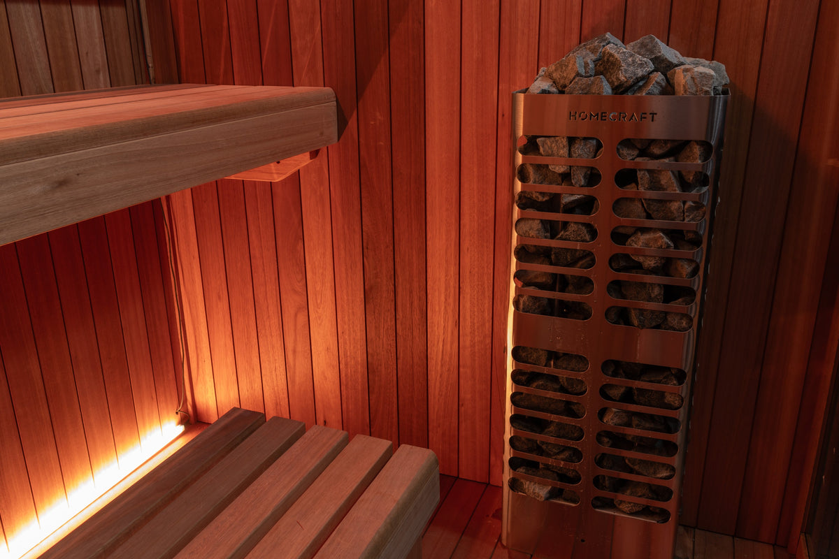 Homecraft electric sauna heater with stones inside the Element Studio sauna