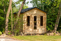 LeisureCraft Georgian cabin sauna front view with glass door and two windows