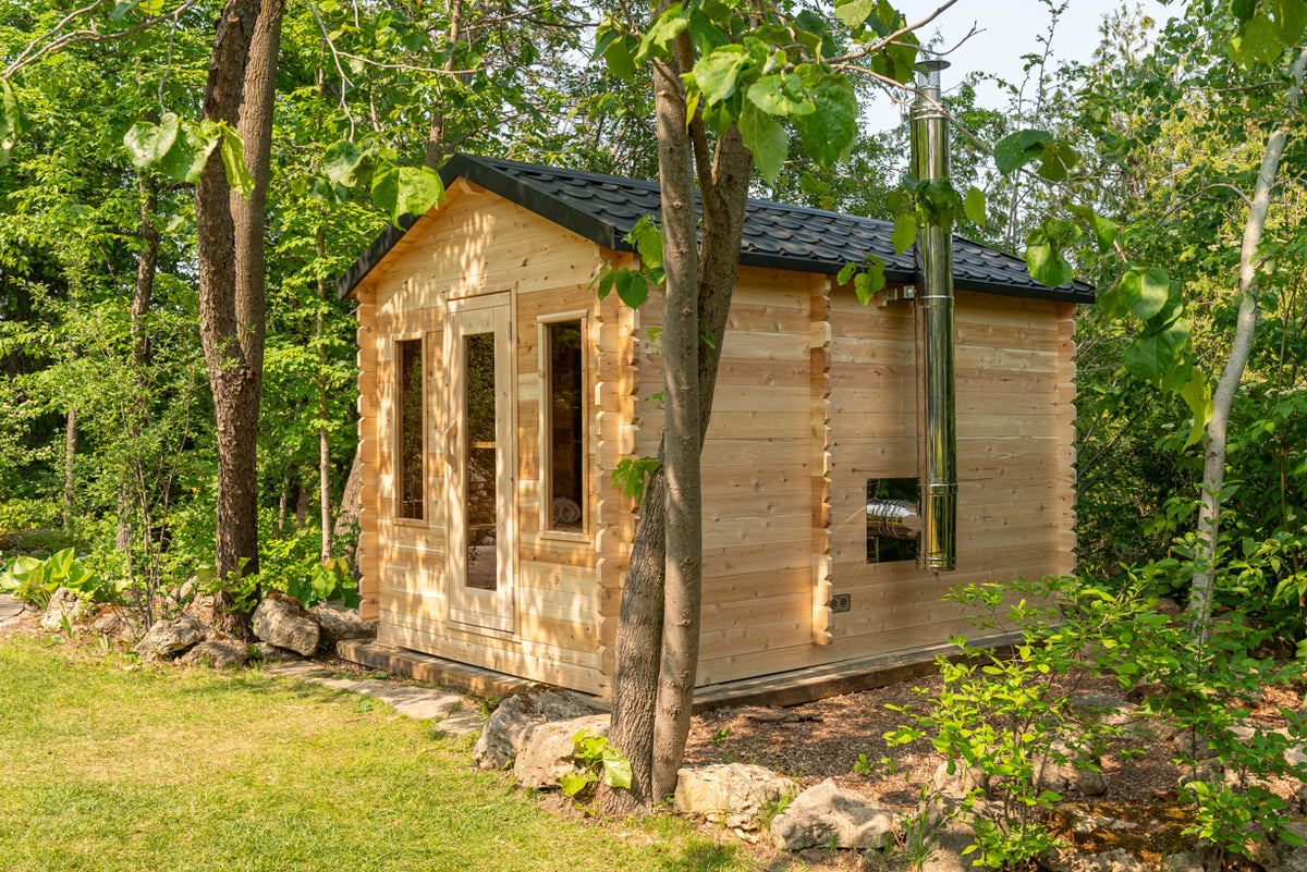Side view of the LeisureCraft Georgian cabin sauna with black steel roof and stainless chimney